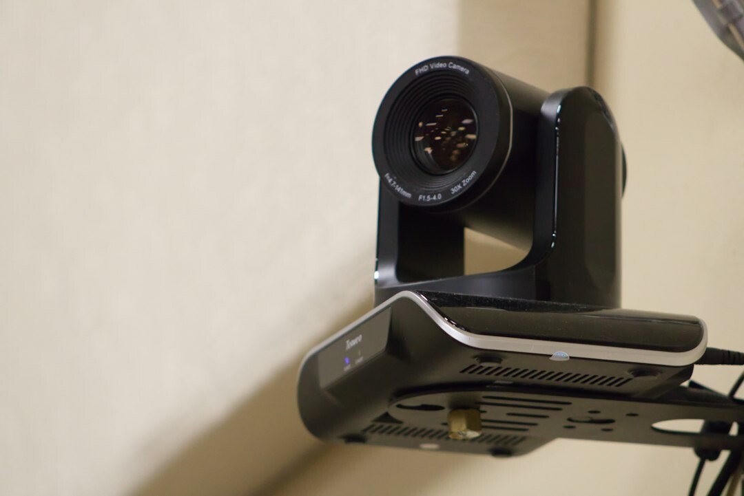 Bank of multiple live camera feed monitors in a broadcast gallery